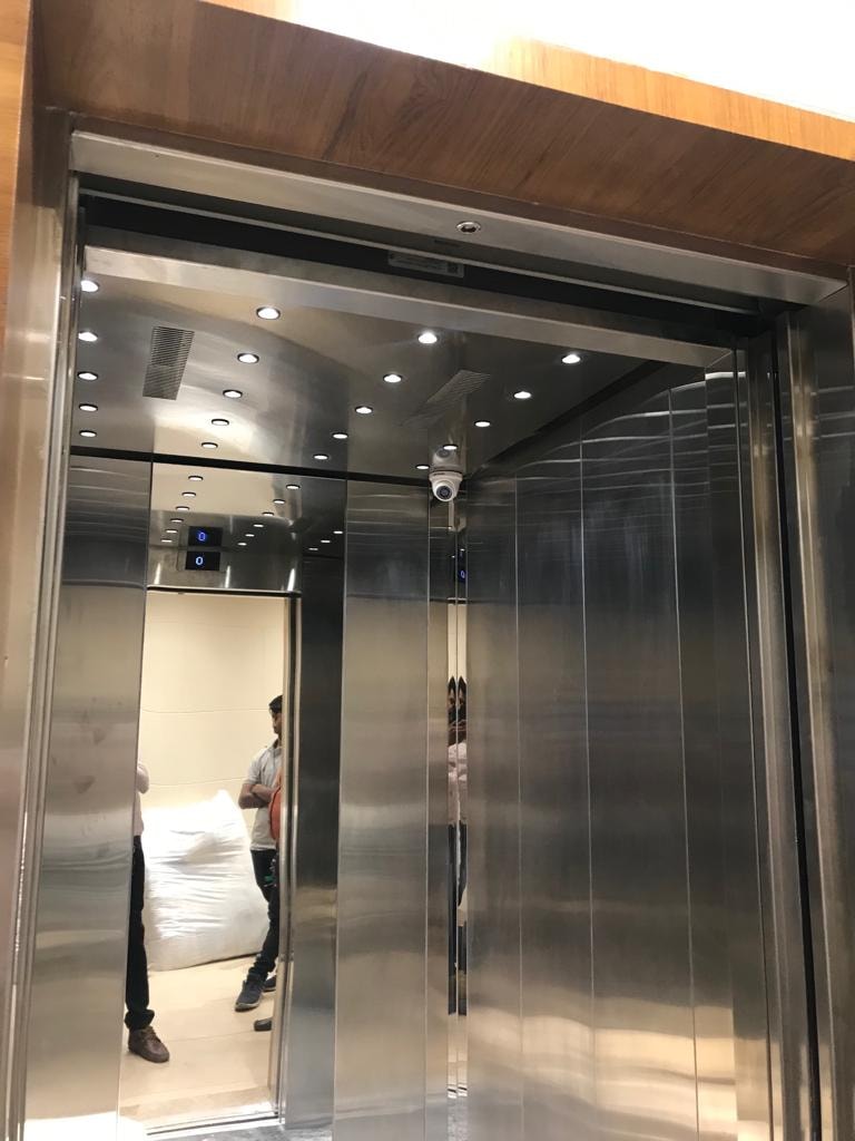 Person standing inside modern elevator